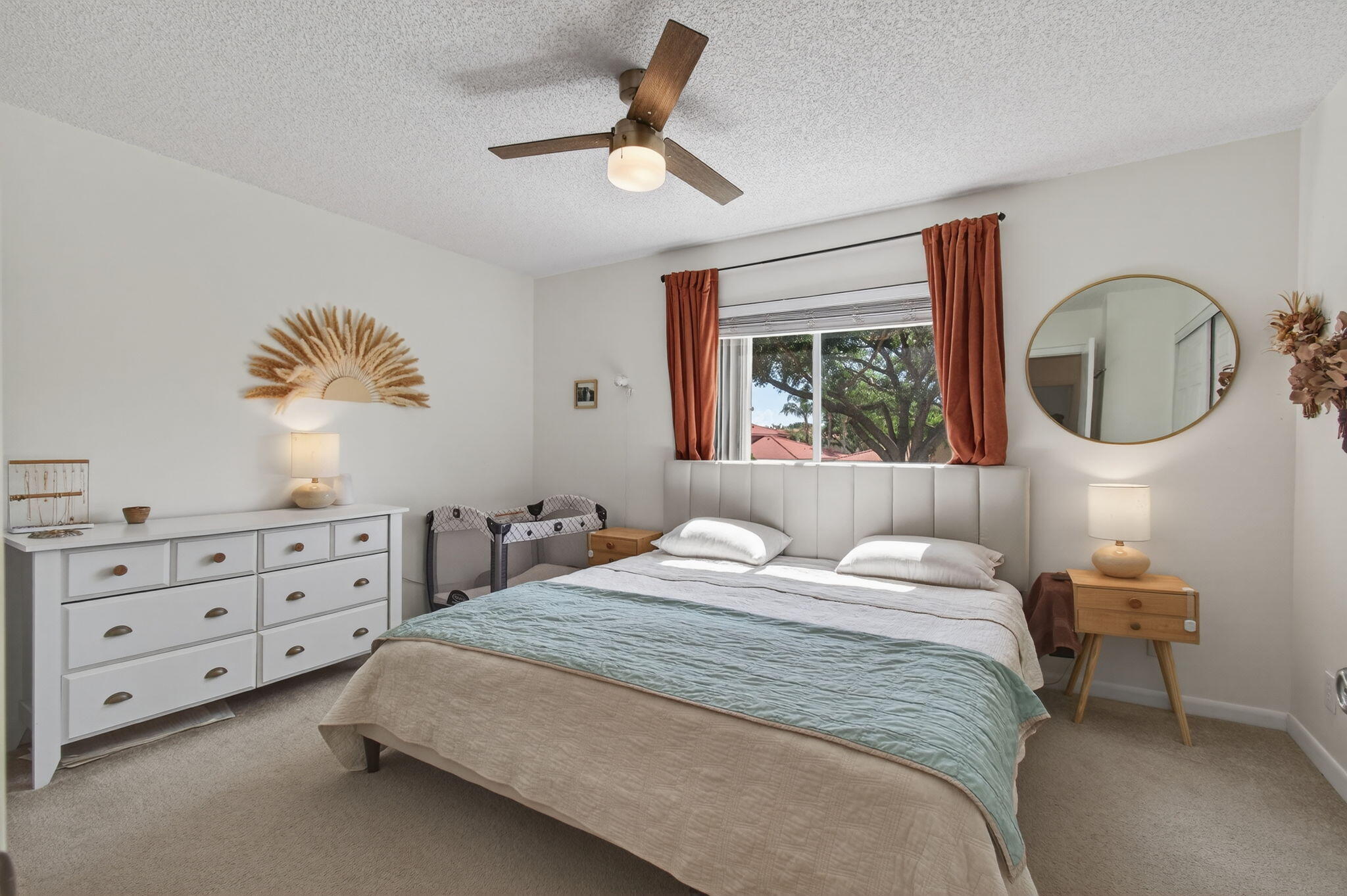 9931 Kamena Circle Boynton Beach, FL 33436 - Photo 17 of 37 a bedroom with a bed and a chandelier