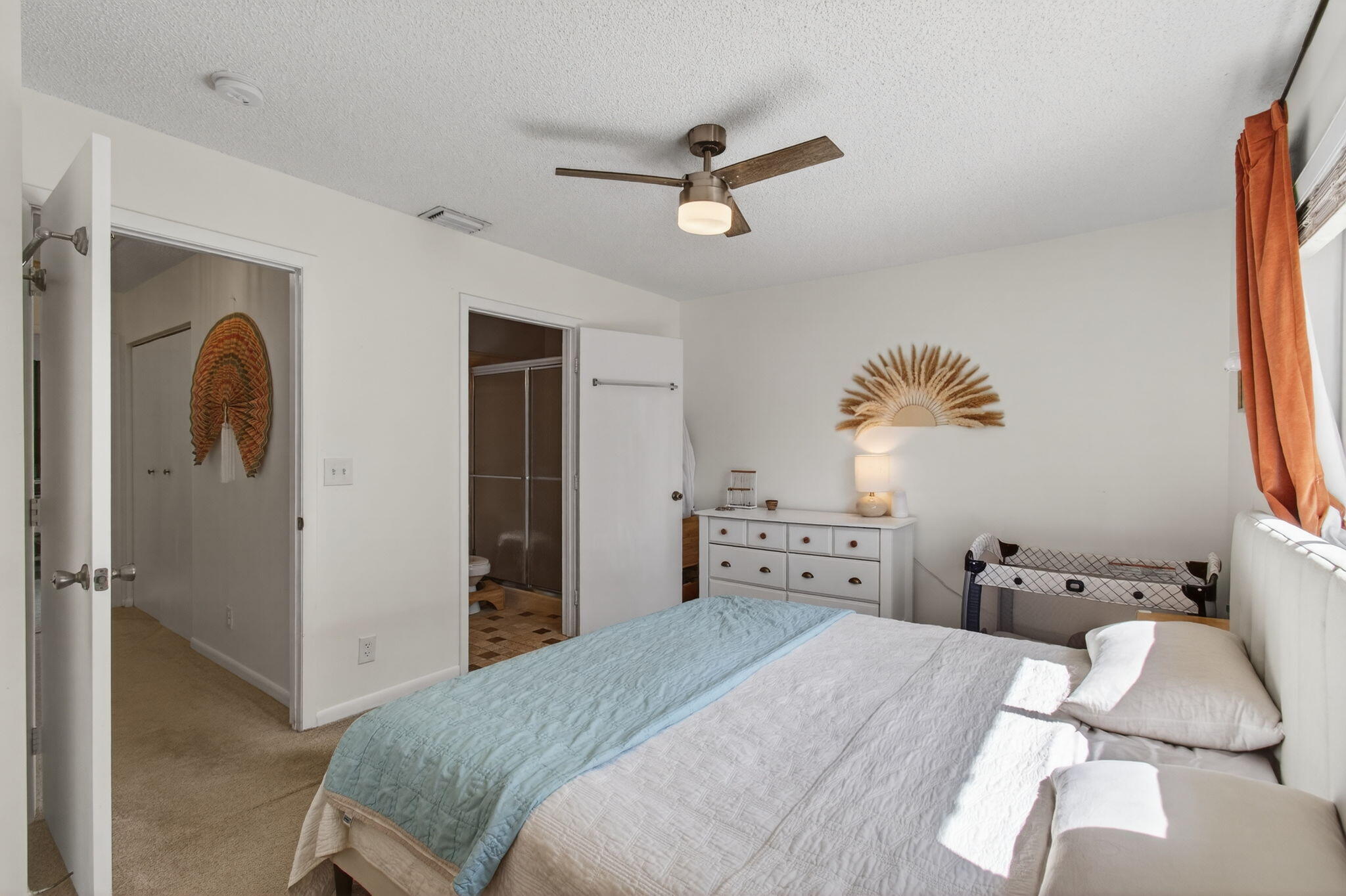 9931 Kamena Circle Boynton Beach, FL 33436 - Photo 18 of 37 a bedroom with a bed and a chandelier