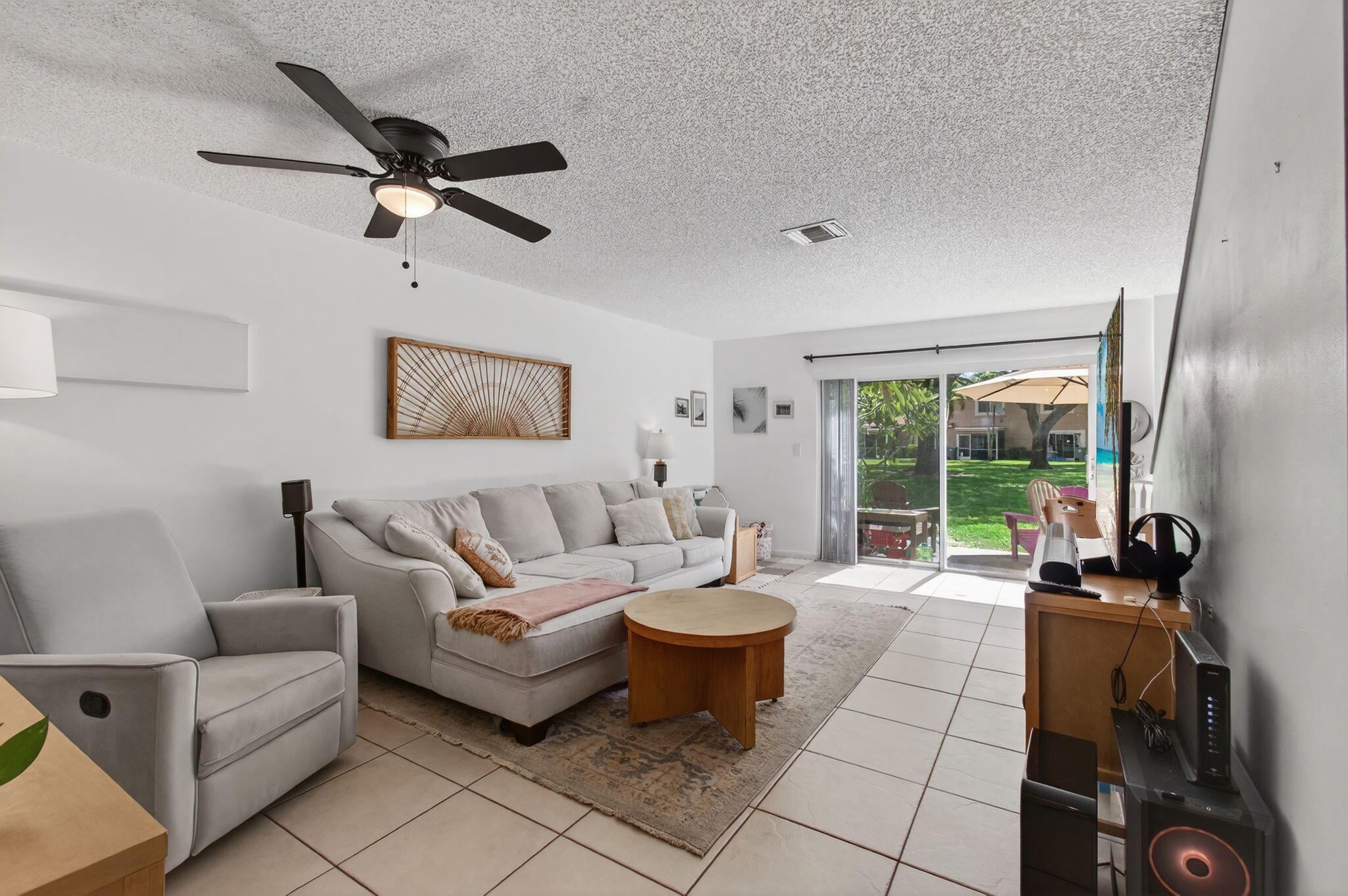 9931 Kamena Circle Boynton Beach, FL 33436 - Photo 2 of 37 a living room with furniture and a large window
