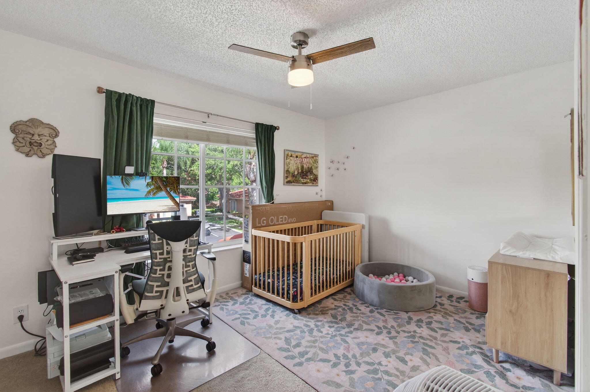 9931 Kamena Circle Boynton Beach, FL 33436 - Photo 22 of 37 a living room with furniture and a flat screen tv