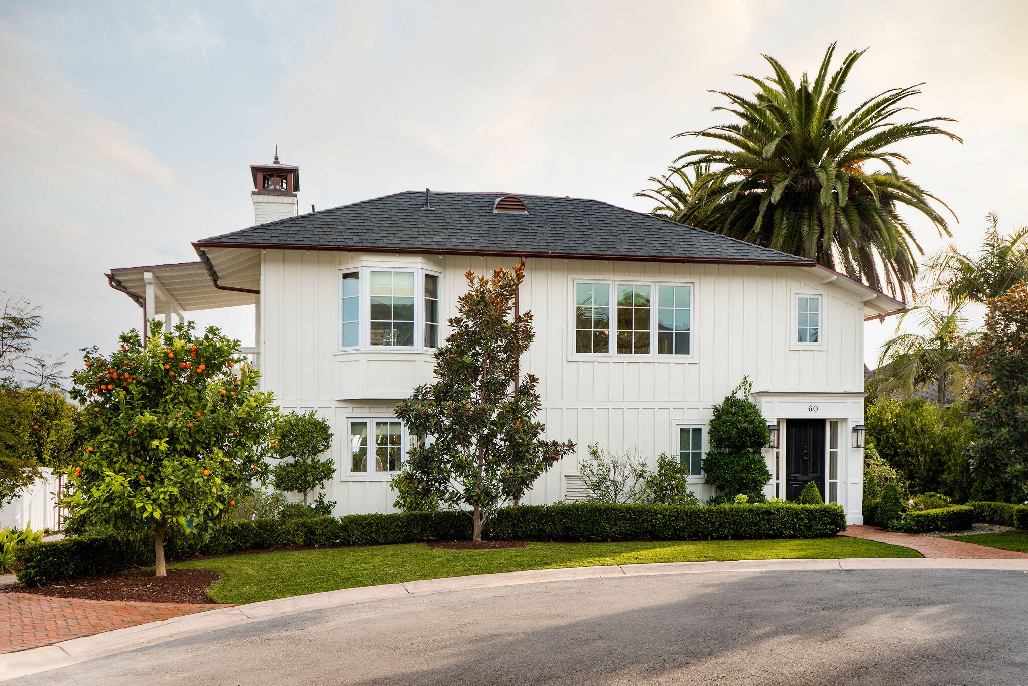 a front view of house with yard and green space