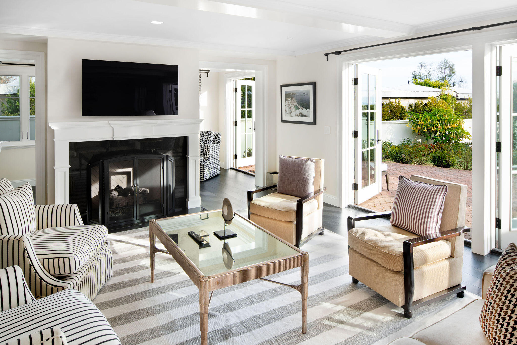 60 Miramar Avenue Montecito, CA 93108 - Photo 11 of 30 a living room with furniture a flat screen tv and a fireplace