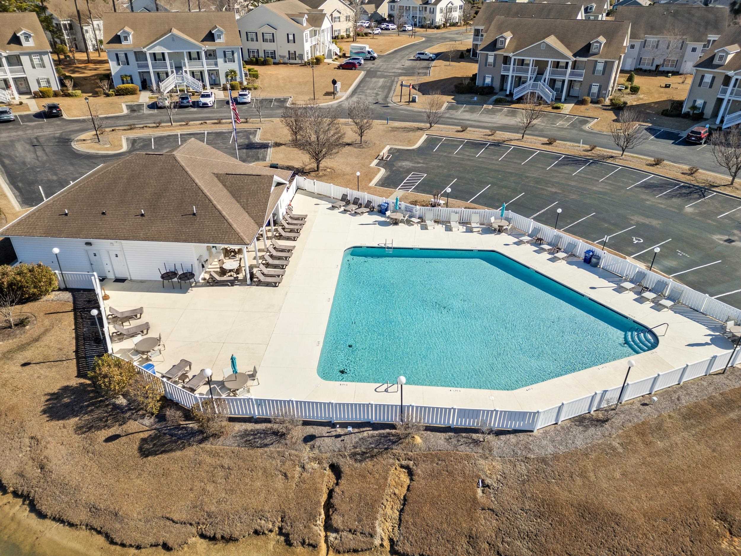 900 Jackline Place, Unit 202 Murrells Inlet, SC 29576 - Photo 9 of 39 Aerial perspective of suburban area with a pool area