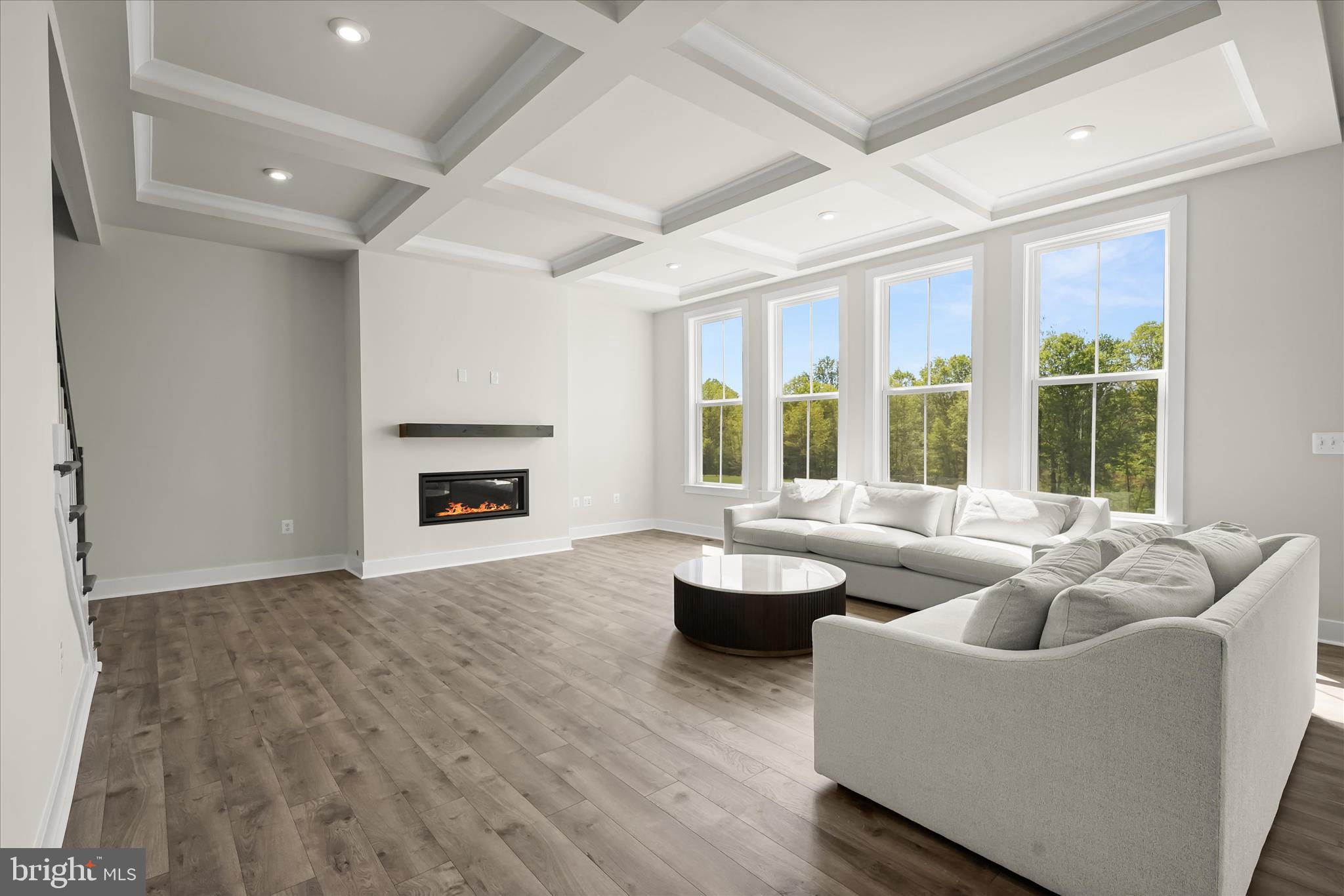 7306 Sugar Magnolia Loop Gainesville, VA 20155 - Photo 16 of 71 a living room with furniture and a fireplace