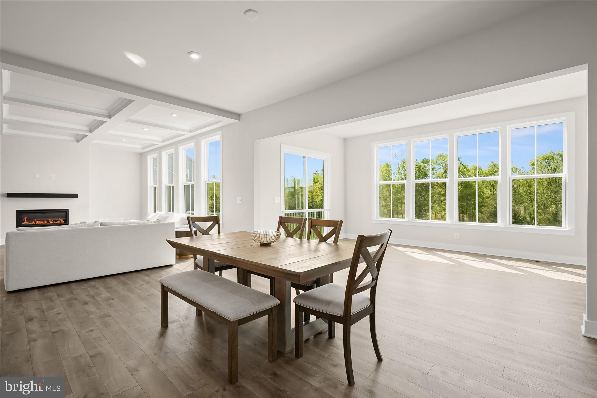7306 Sugar Magnolia Loop Gainesville, VA 20155 - Photo 68 of 71 a view of a dining room with furniture and wooden floor