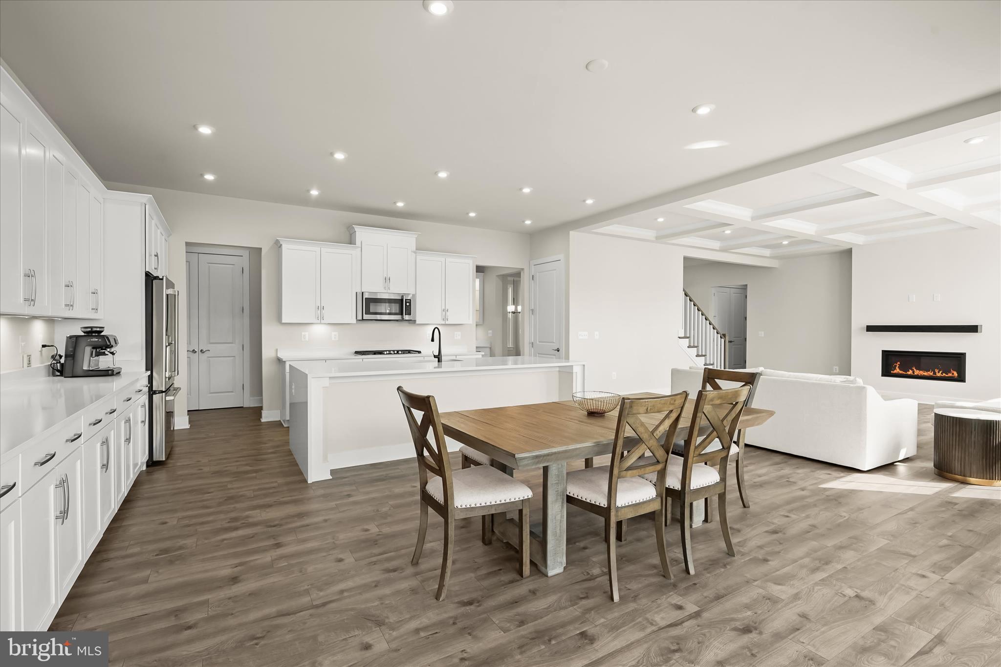7306 Sugar Magnolia Loop Gainesville, VA 20155 - Photo 69 of 71 a view of kitchen with cabinets table and chairs