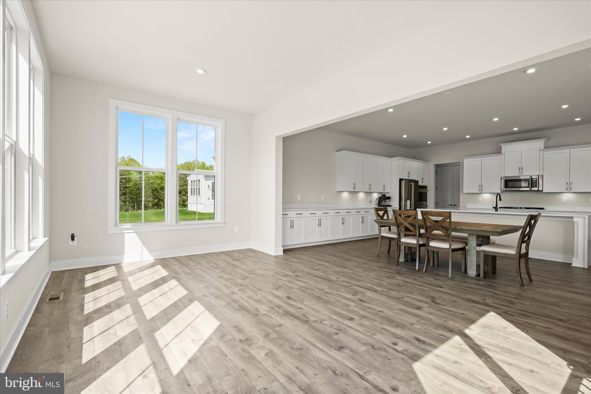 7306 Sugar Magnolia Loop Gainesville, VA 20155 - Photo 23 of 71 a view of a kitchen and dining room