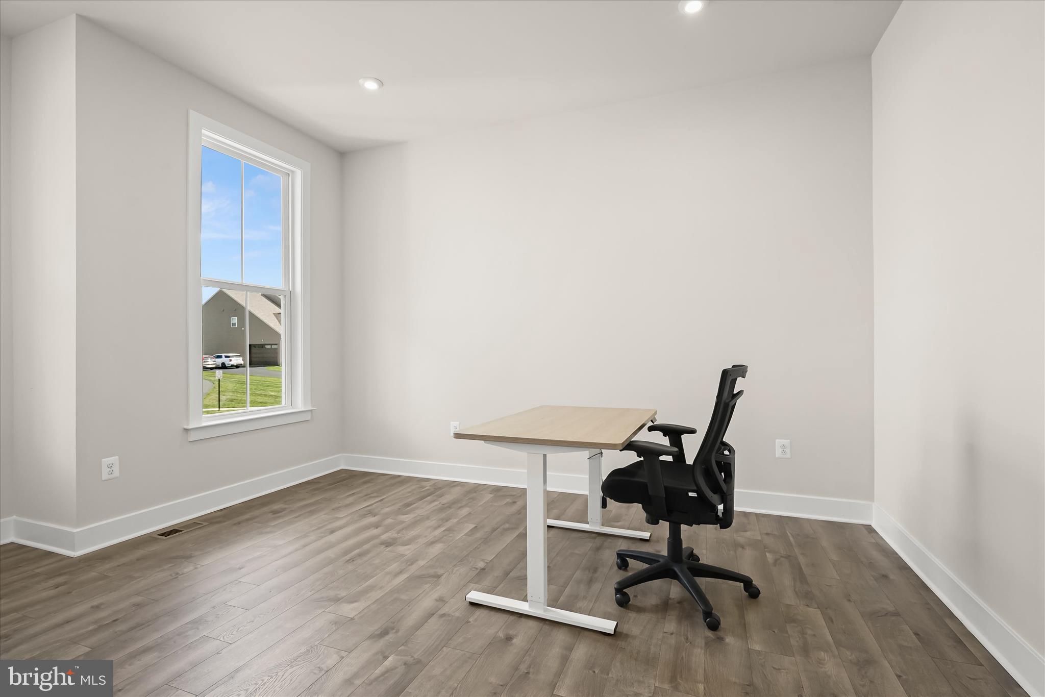 7306 Sugar Magnolia Loop Gainesville, VA 20155 - Photo 26 of 71 a view of a workspace with furniture and a window