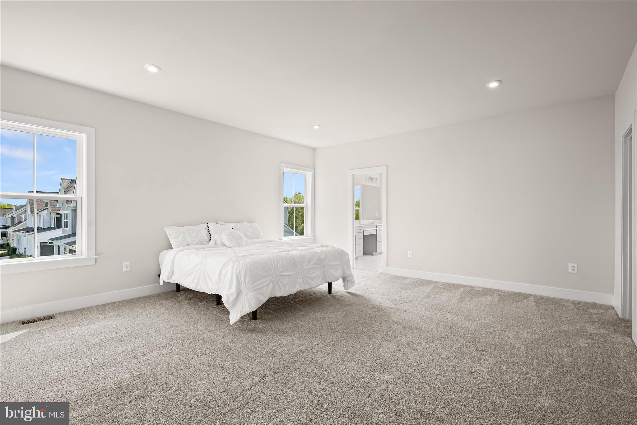 7306 Sugar Magnolia Loop Gainesville, VA 20155 - Photo 34 of 71 a spacious bedroom with a bed and a window