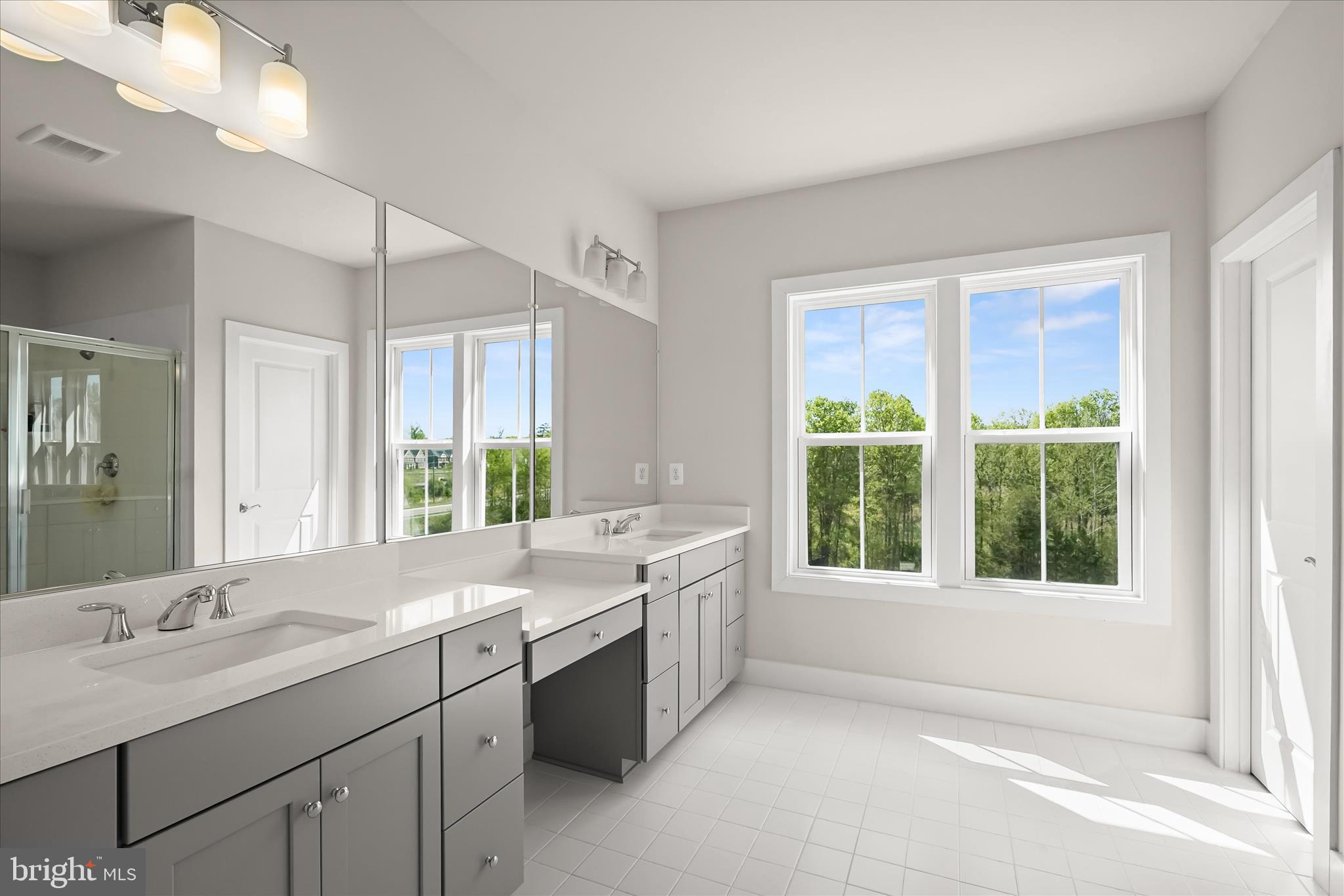 7306 Sugar Magnolia Loop Gainesville, VA 20155 - Photo 39 of 71 a bathroom with a sink and a bathtub