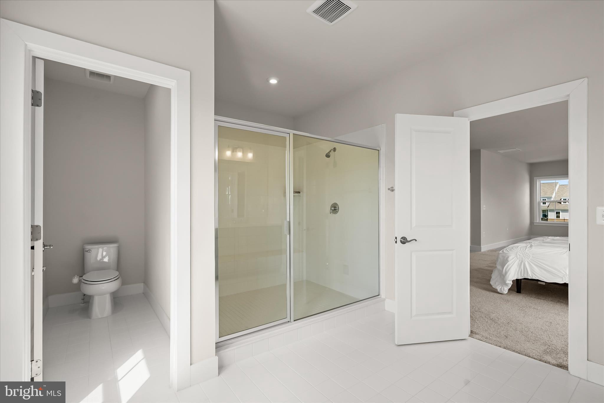 7306 Sugar Magnolia Loop Gainesville, VA 20155 - Photo 41 of 71 a bathroom with a shower and a toilet
