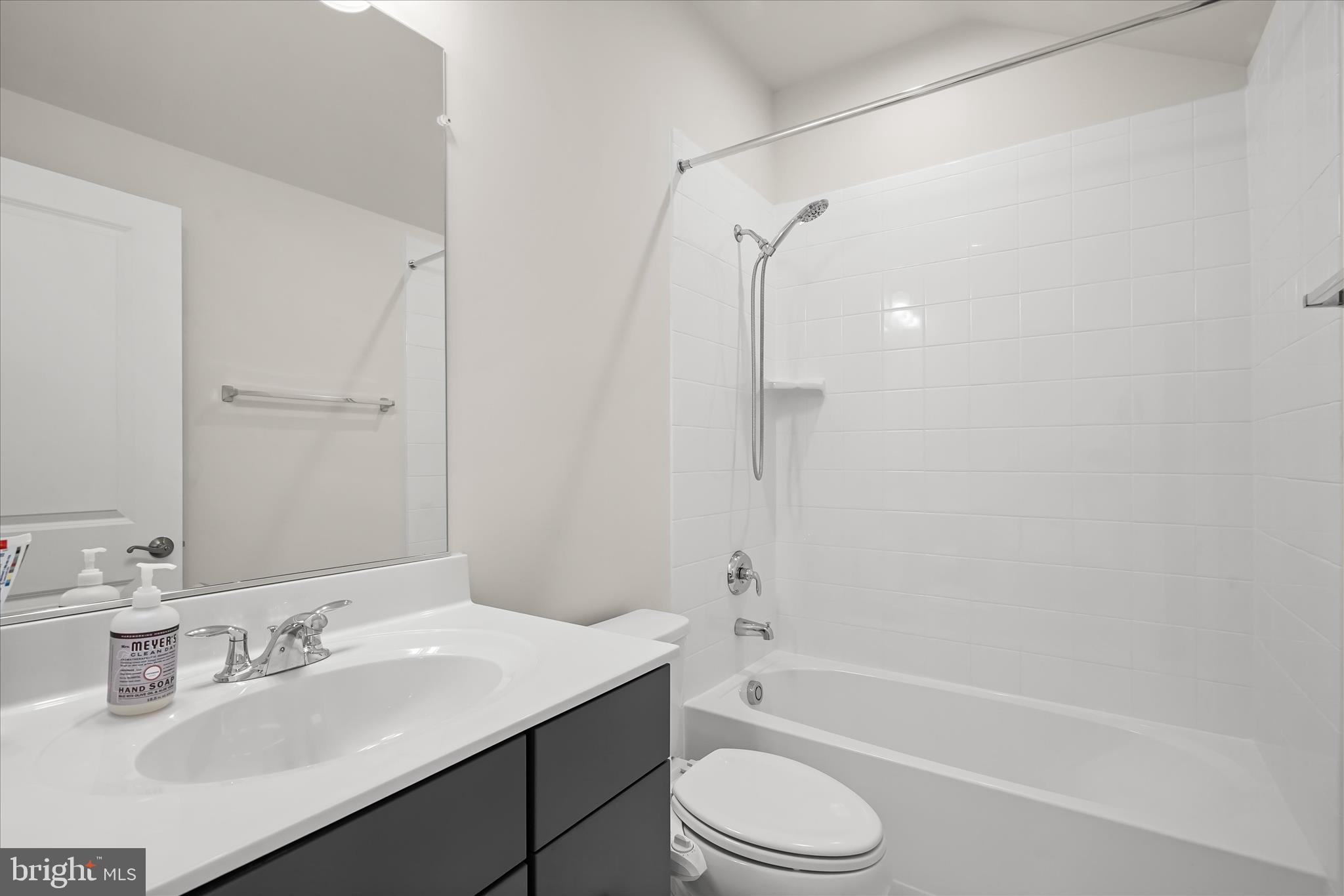 7306 Sugar Magnolia Loop Gainesville, VA 20155 - Photo 44 of 71 a bathroom with a granite countertop bathtub shower sink vanity and toilet