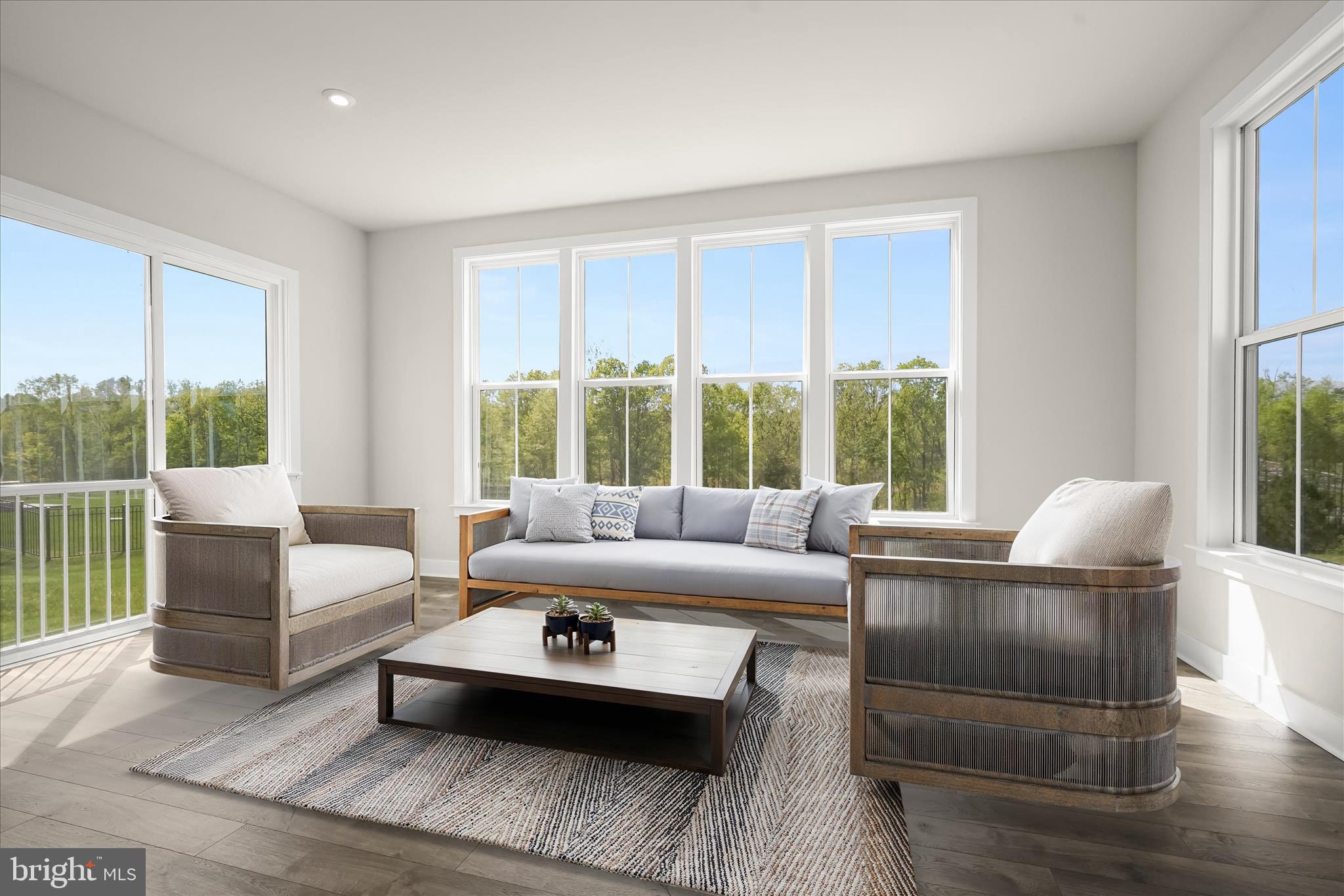 7306 Sugar Magnolia Loop Gainesville, VA 20155 - Photo 4 of 71 a living room with furniture and a large window