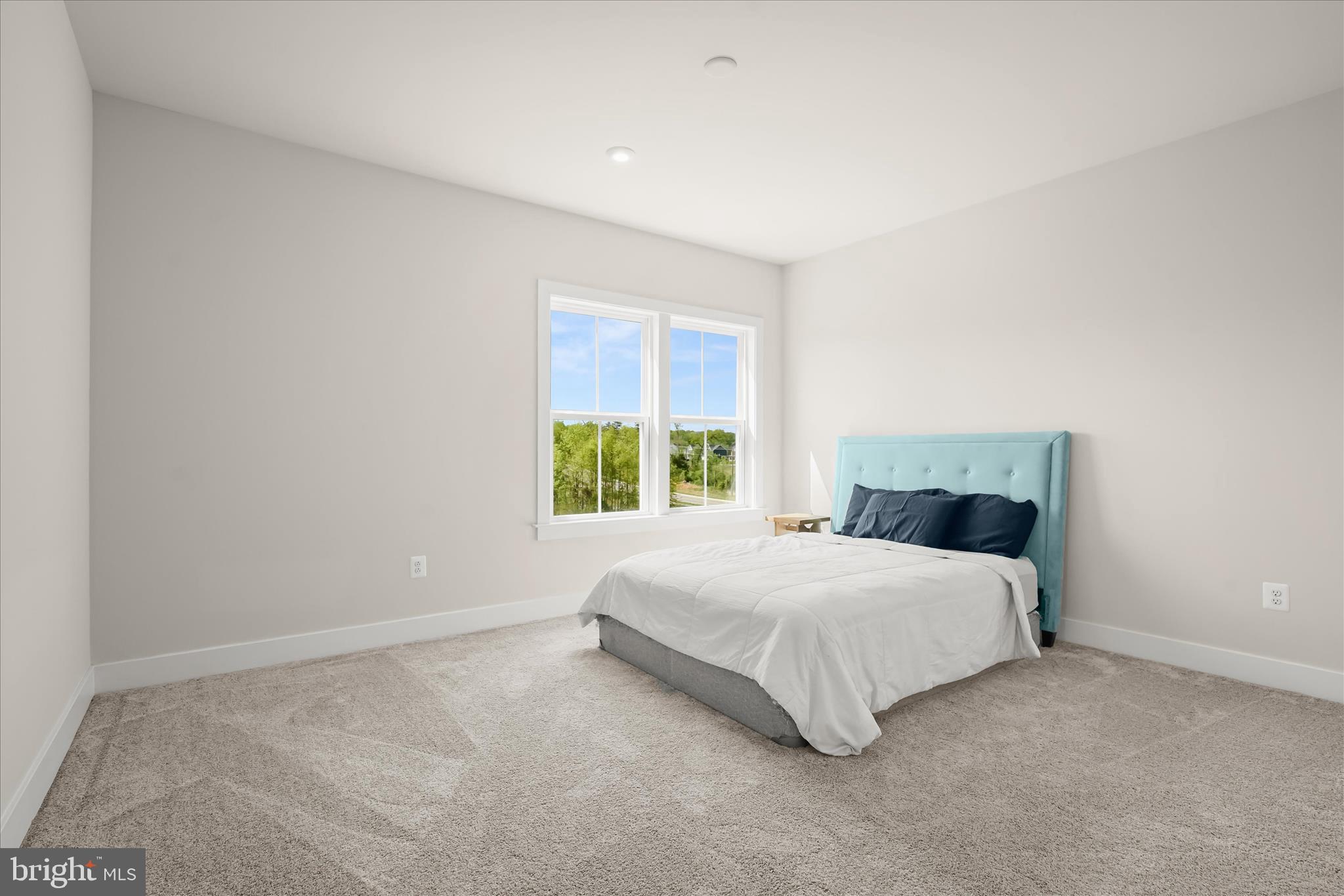7306 Sugar Magnolia Loop Gainesville, VA 20155 - Photo 46 of 71 a bedroom with a bed and a window