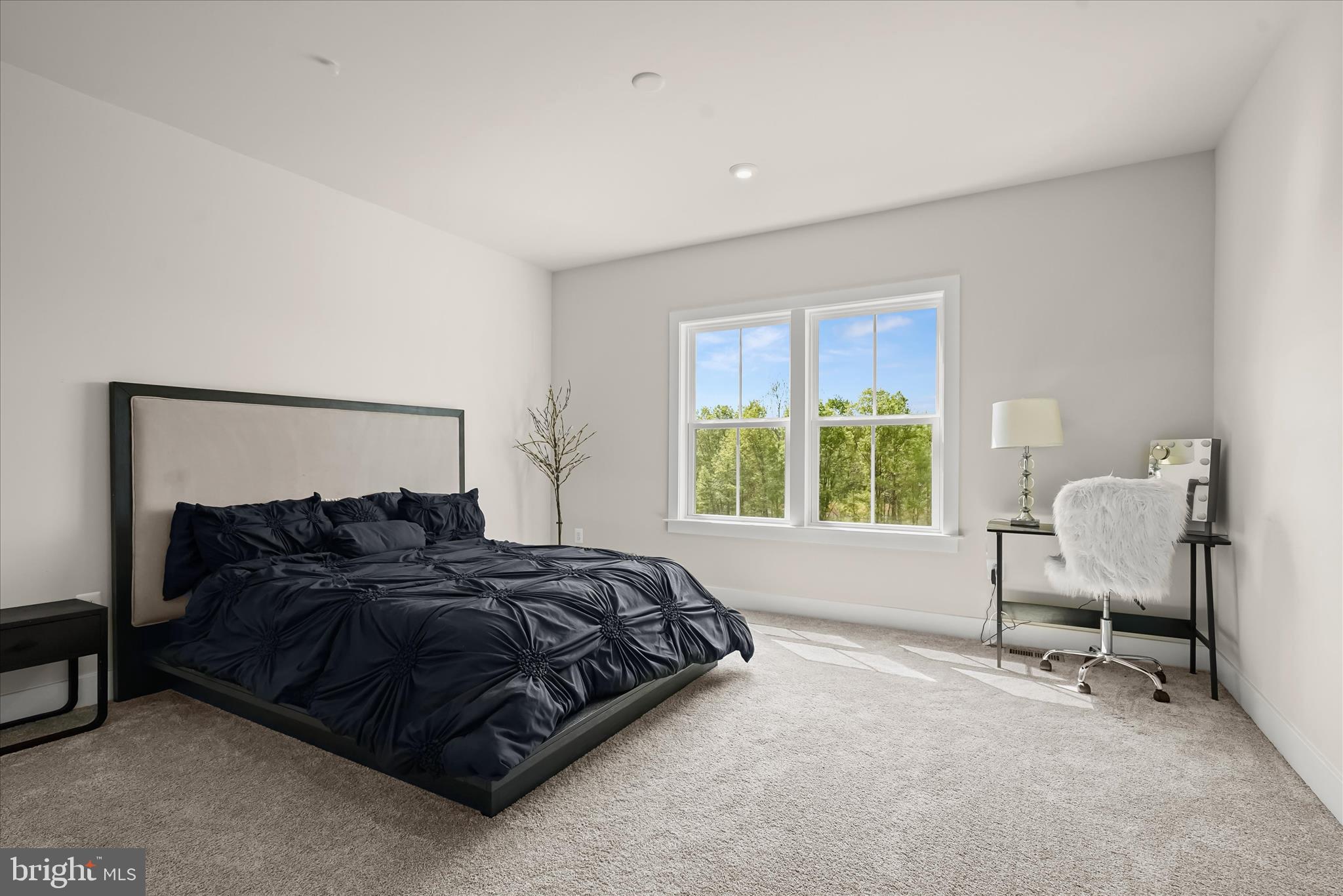 7306 Sugar Magnolia Loop Gainesville, VA 20155 - Photo 48 of 71 a bedroom with a bed and a window