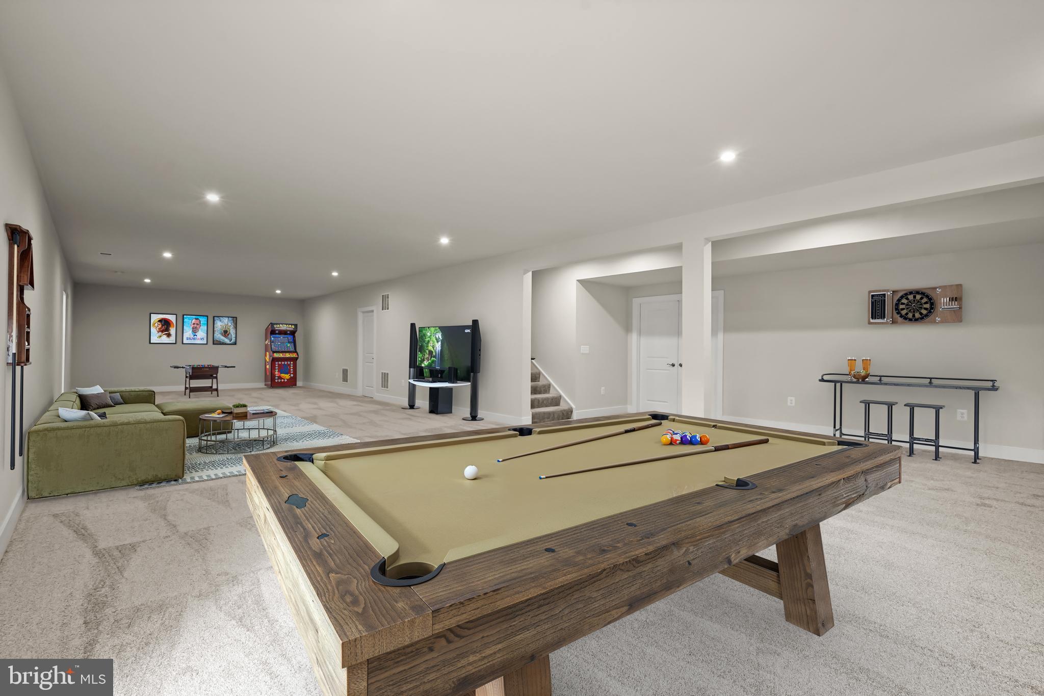 7306 Sugar Magnolia Loop Gainesville, VA 20155 - Photo 5 of 71 a room with furniture pool table and a wooden floor