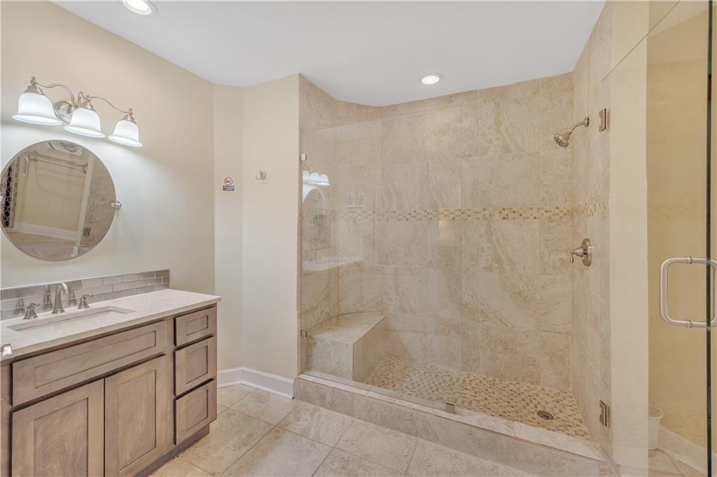 4152 Yearling Way Lithonia, GA 30038 - Photo 10 of 13 a bathroom with a sink a toilet and shower