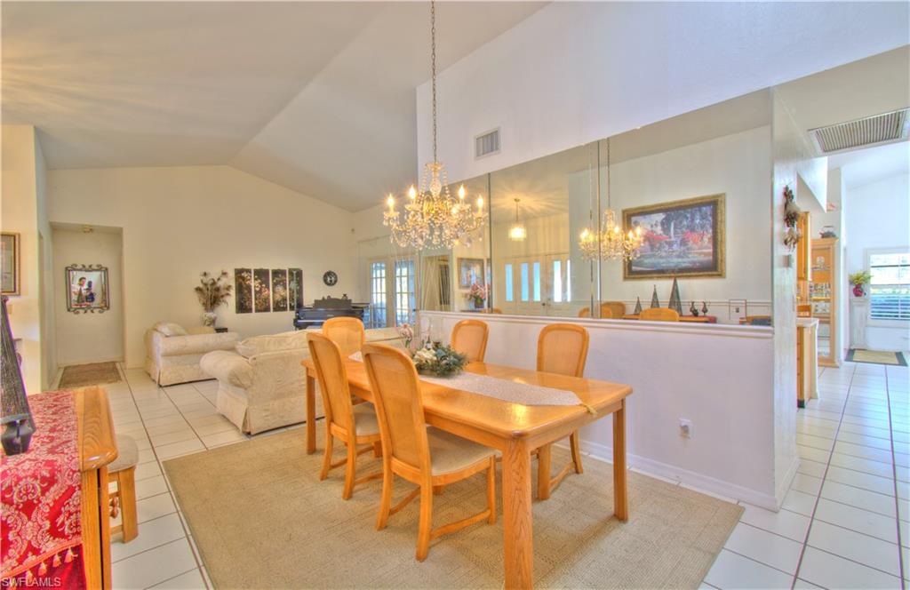 2600 Garland Road Naples, FL 34117 - Photo 12 of 34 a view of a dining room with furniture