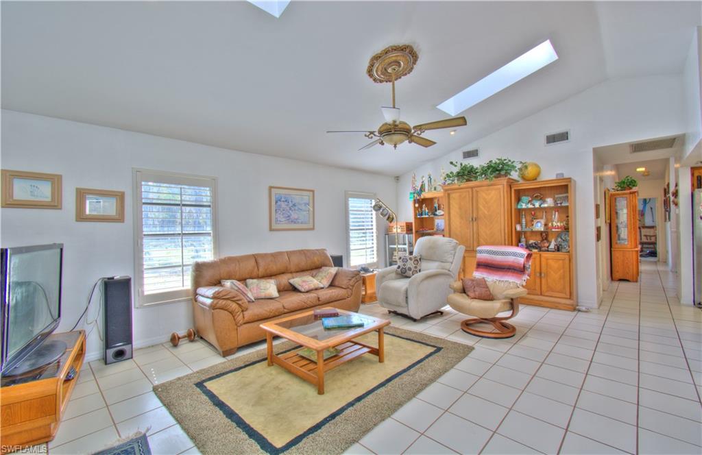 2600 Garland Road Naples, FL 34117 - Photo 16 of 34 a living room with furniture and wooden floor