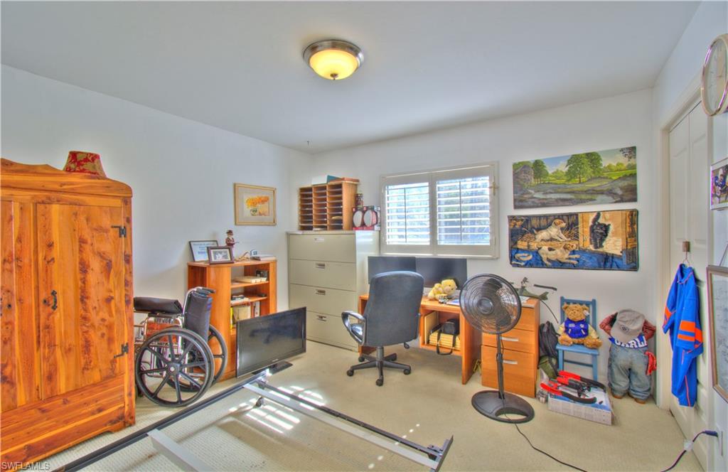 2600 Garland Road Naples, FL 34117 - Photo 21 of 34 a living room with furniture and a table