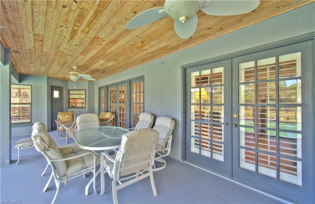 2600 Garland Road Naples, FL 34117 - Photo 27 of 34 a dining room with furniture and window