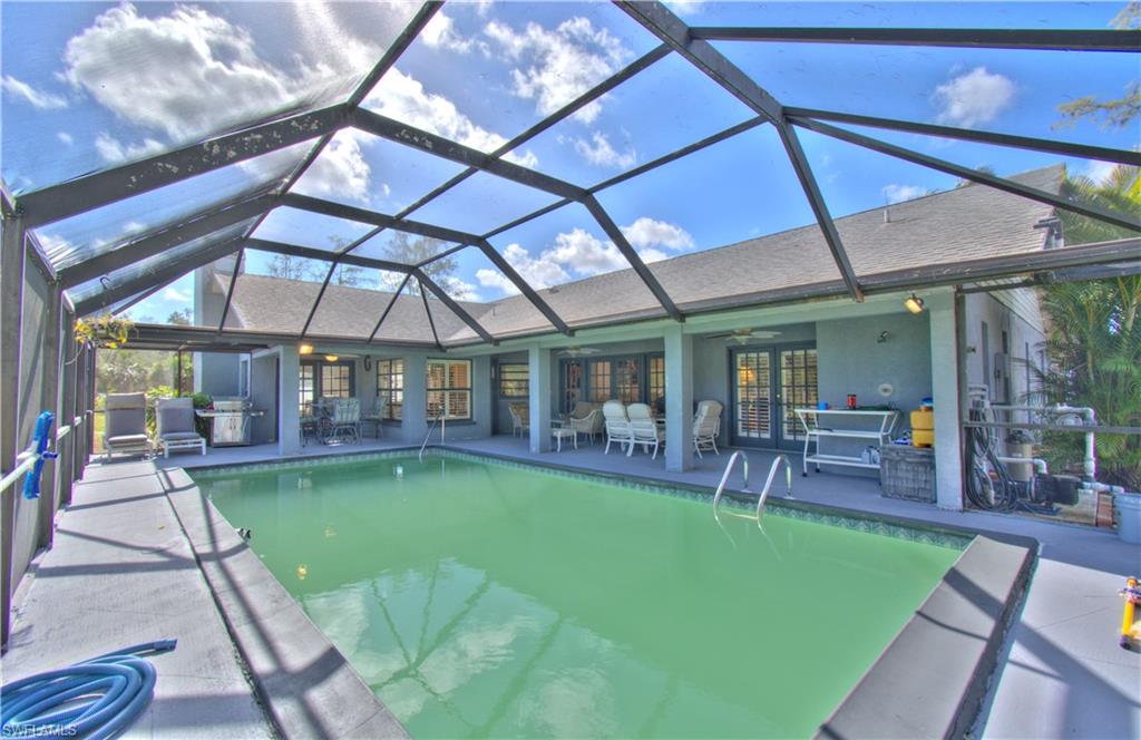 2600 Garland Road Naples, FL 34117 - Photo 29 of 34 a view of a swimming pool with a patio