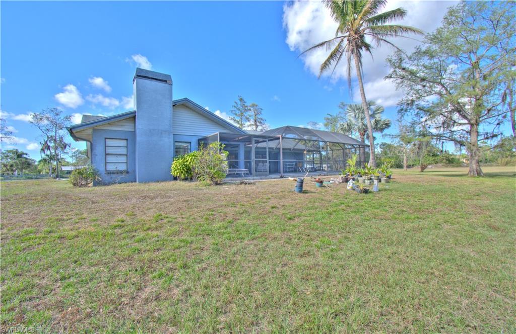 2600 Garland Road Naples, FL 34117 - Photo 32 of 34 a front view of a house with a yard