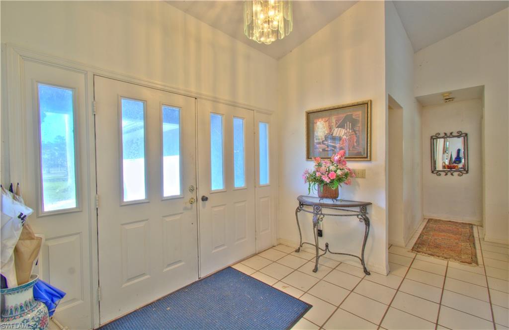 2600 Garland Road Naples, FL 34117 - Photo 6 of 34 a view of an entryway with wooden floor