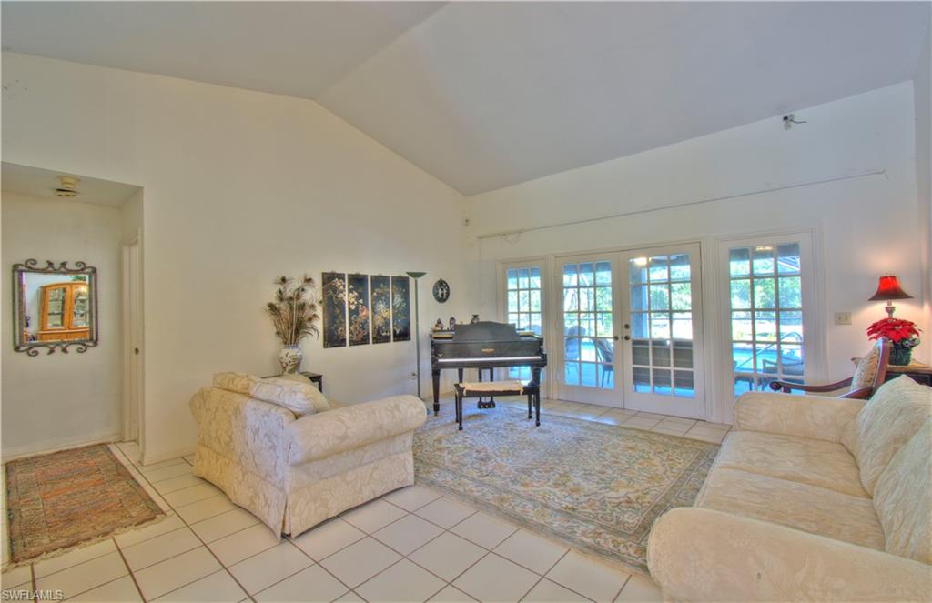 2600 Garland Road Naples, FL 34117 - Photo 7 of 34 a living room with furniture and a table