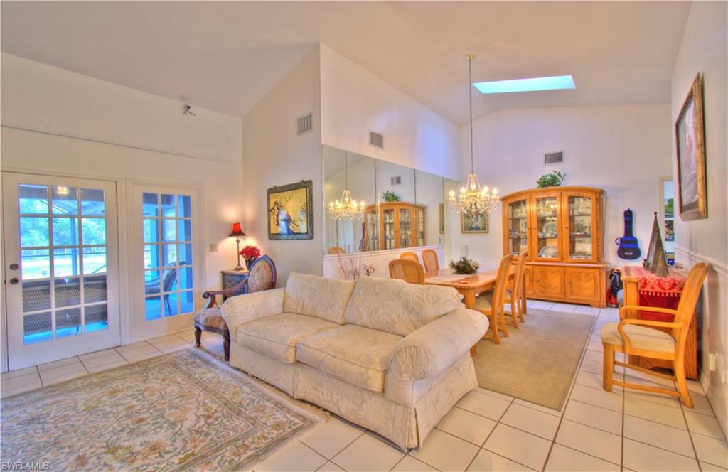 2600 Garland Road Naples, FL 34117 - Photo 8 of 34 a living room with furniture and a rug
