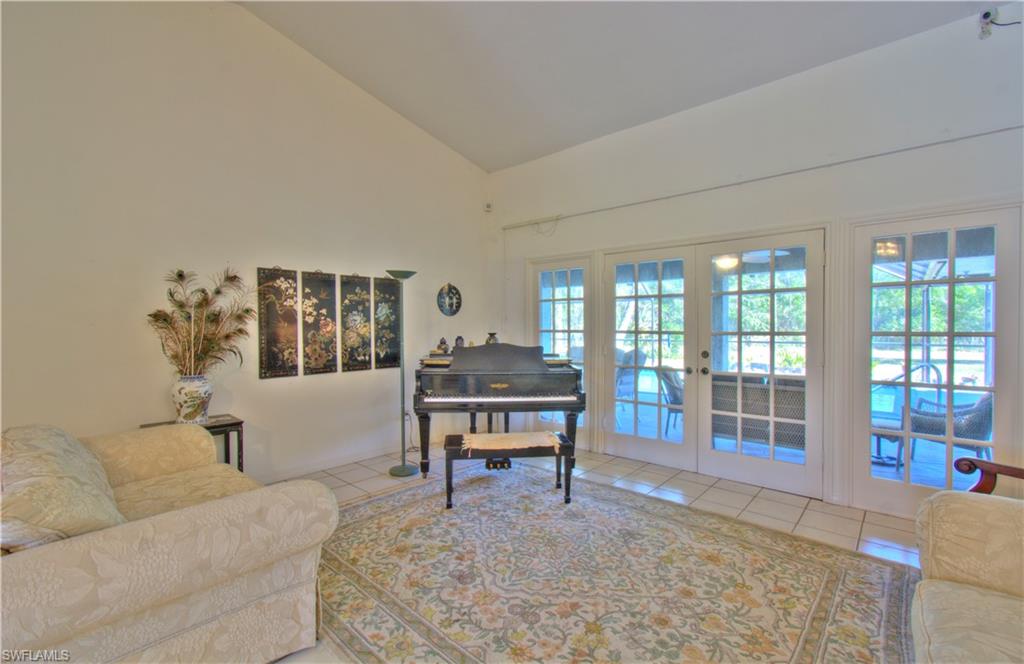 2600 Garland Road Naples, FL 34117 - Photo 9 of 34 a living room with furniture and a table