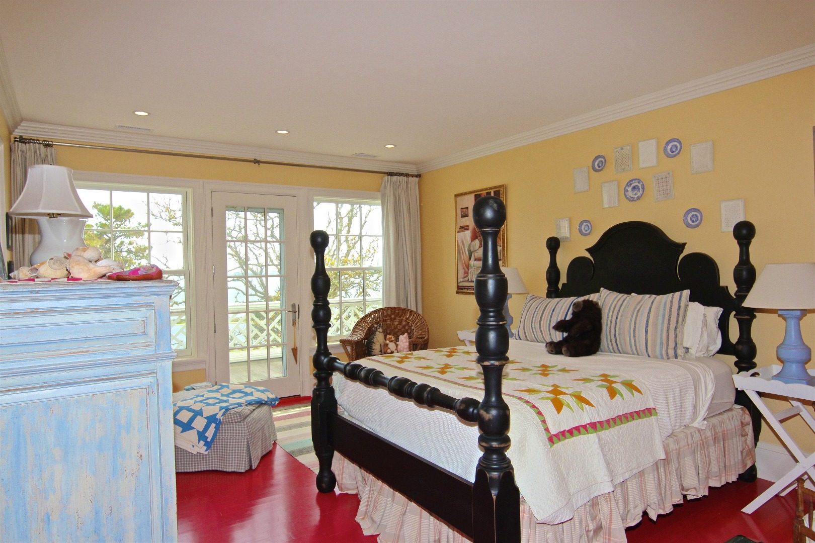 22 Lelands Path Edgartown, MA 02539 - Photo 48 of 87 a bedroom with a bed and wooden floor