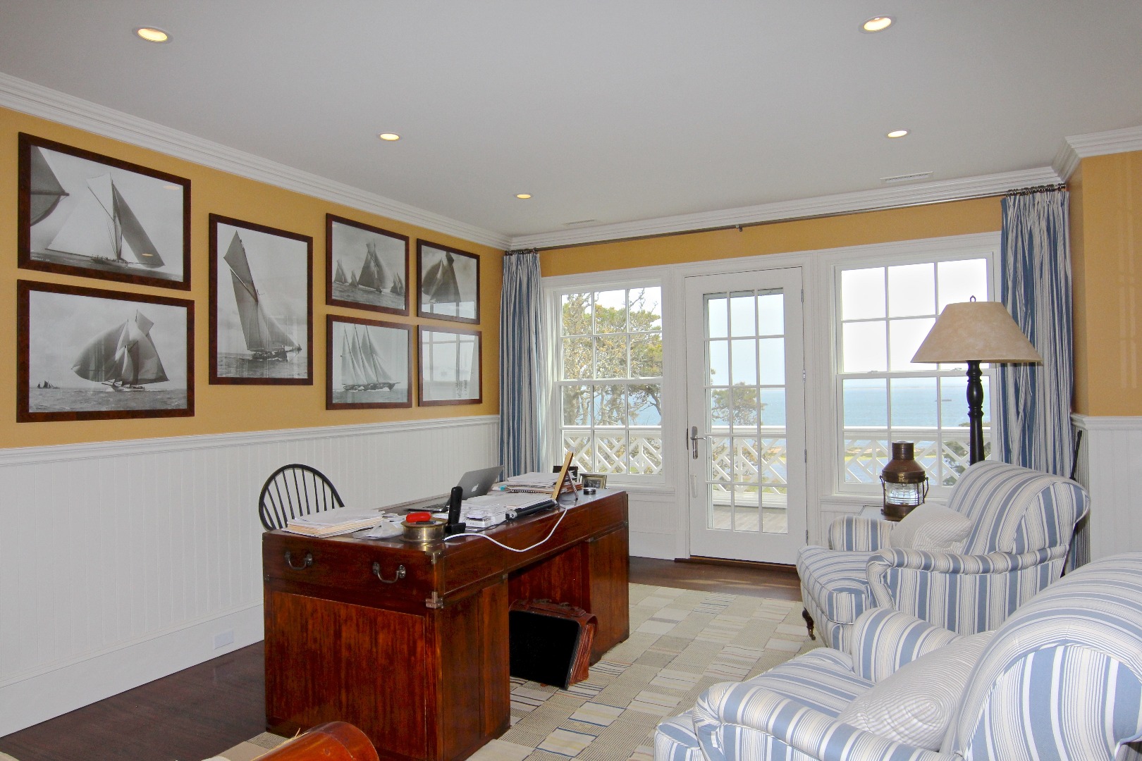 22 Lelands Path Edgartown, MA 02539 - Photo 62 of 87 a living room with furniture and large windows