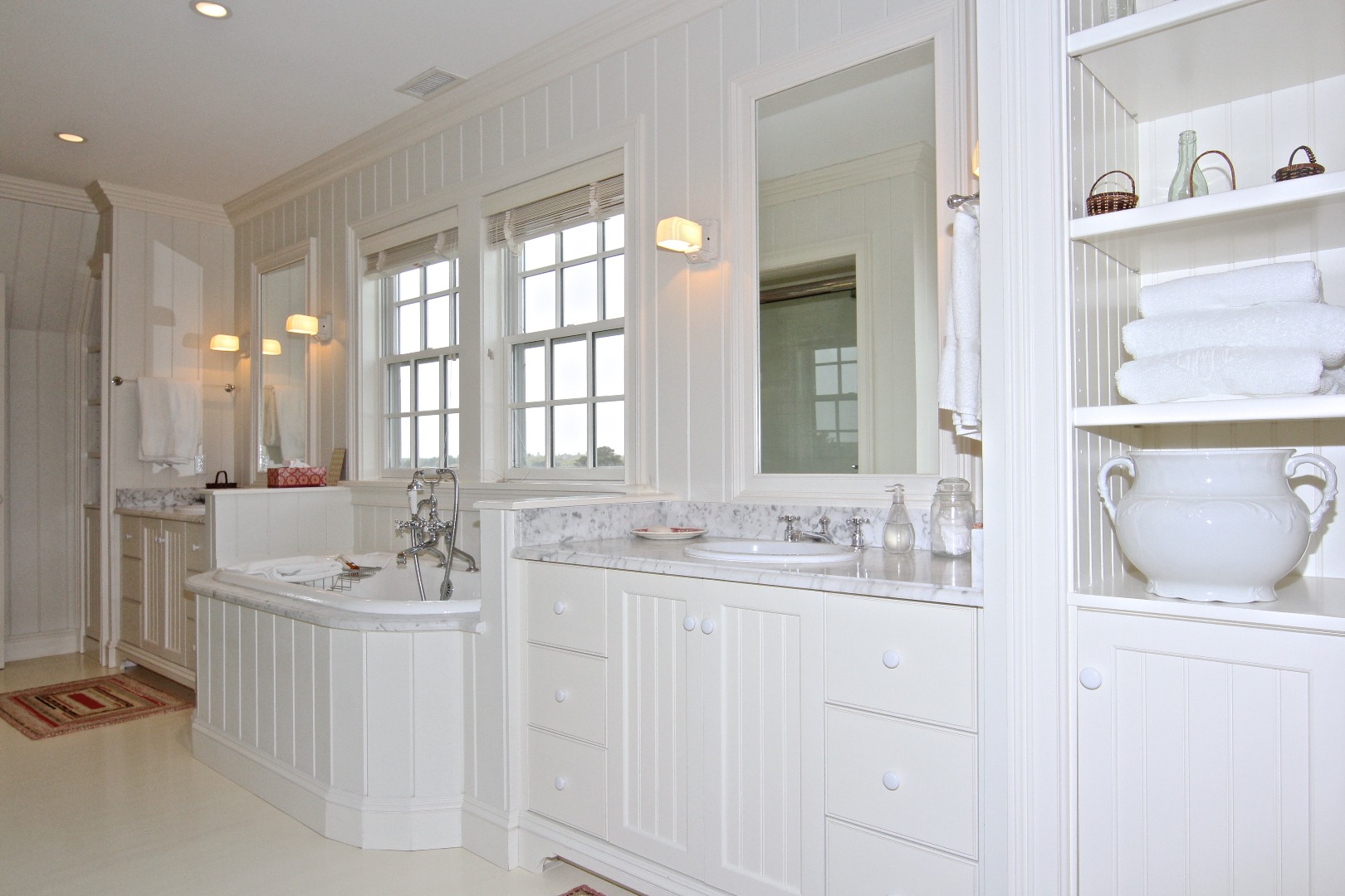 22 Lelands Path Edgartown, MA 02539 - Photo 70 of 87 a bathroom with double vanity sinks a mirror and a bathtub