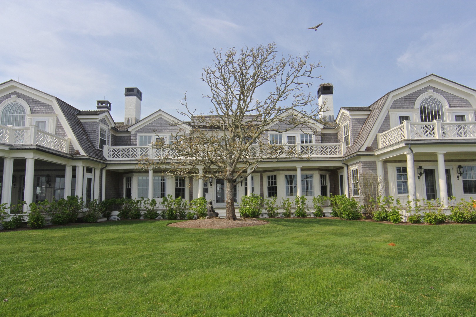 22 Lelands Path Edgartown, MA 02539 - Photo 77 of 87 a front view of a house with a garden