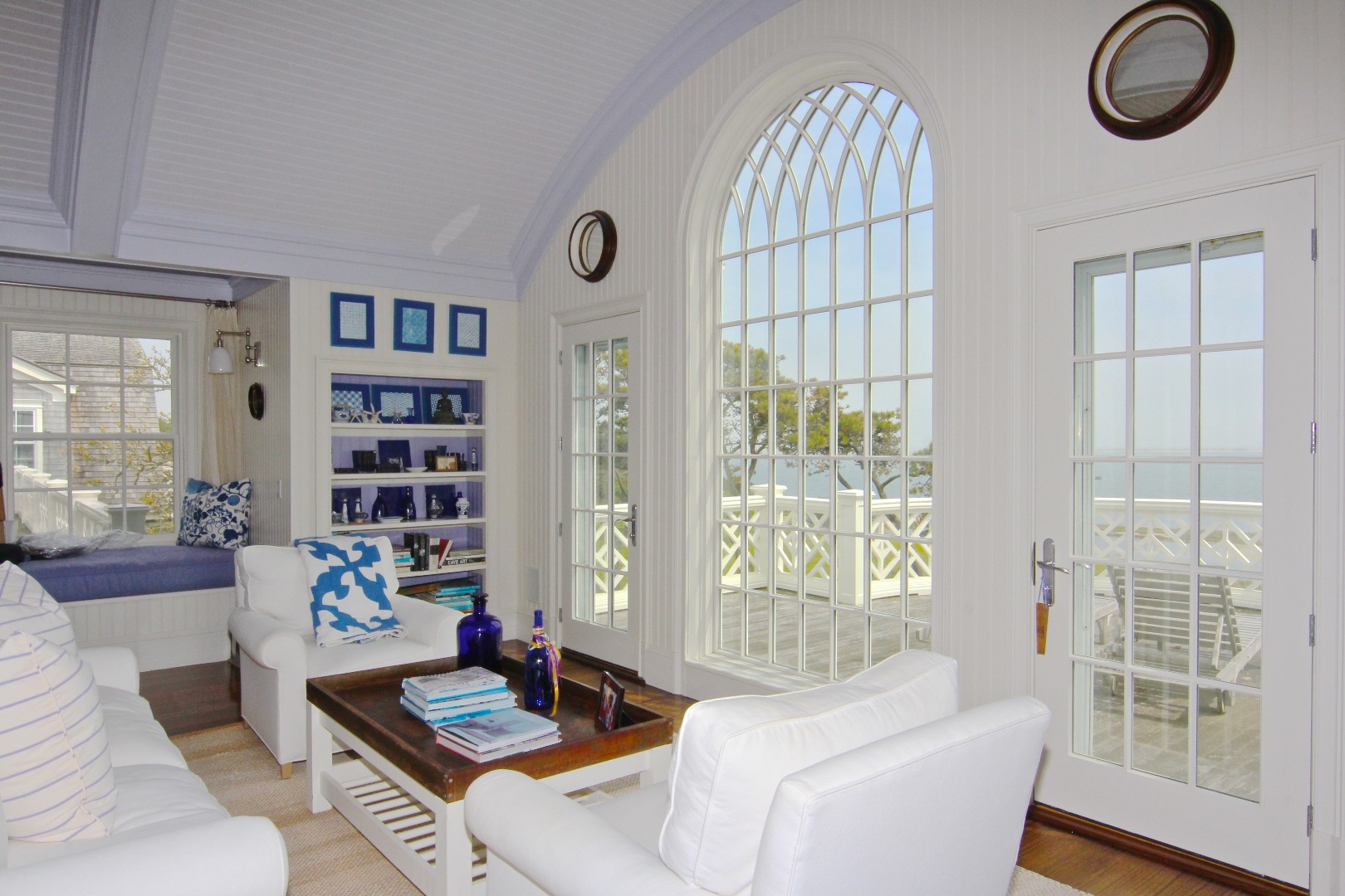 22 Lelands Path Edgartown, MA 02539 - Photo 87 of 87 a living room with furniture and a floor to ceiling window