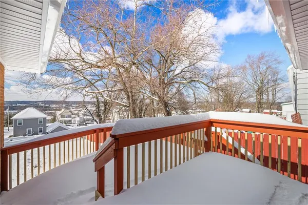 a view of a balcony with trees