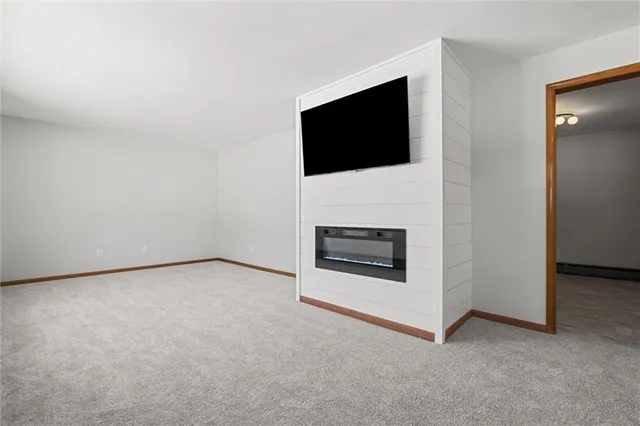a view of an empty room with washing kitchen