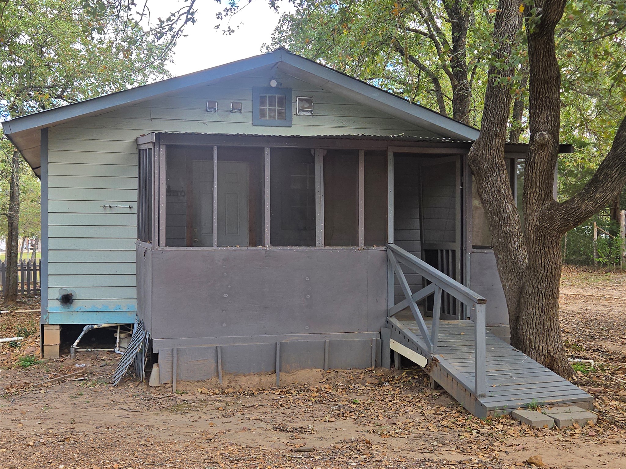 147 Sunset Heights Bastrop, TX 78602 - Photo 11 of 20 a view of a house with a window and wooden fence