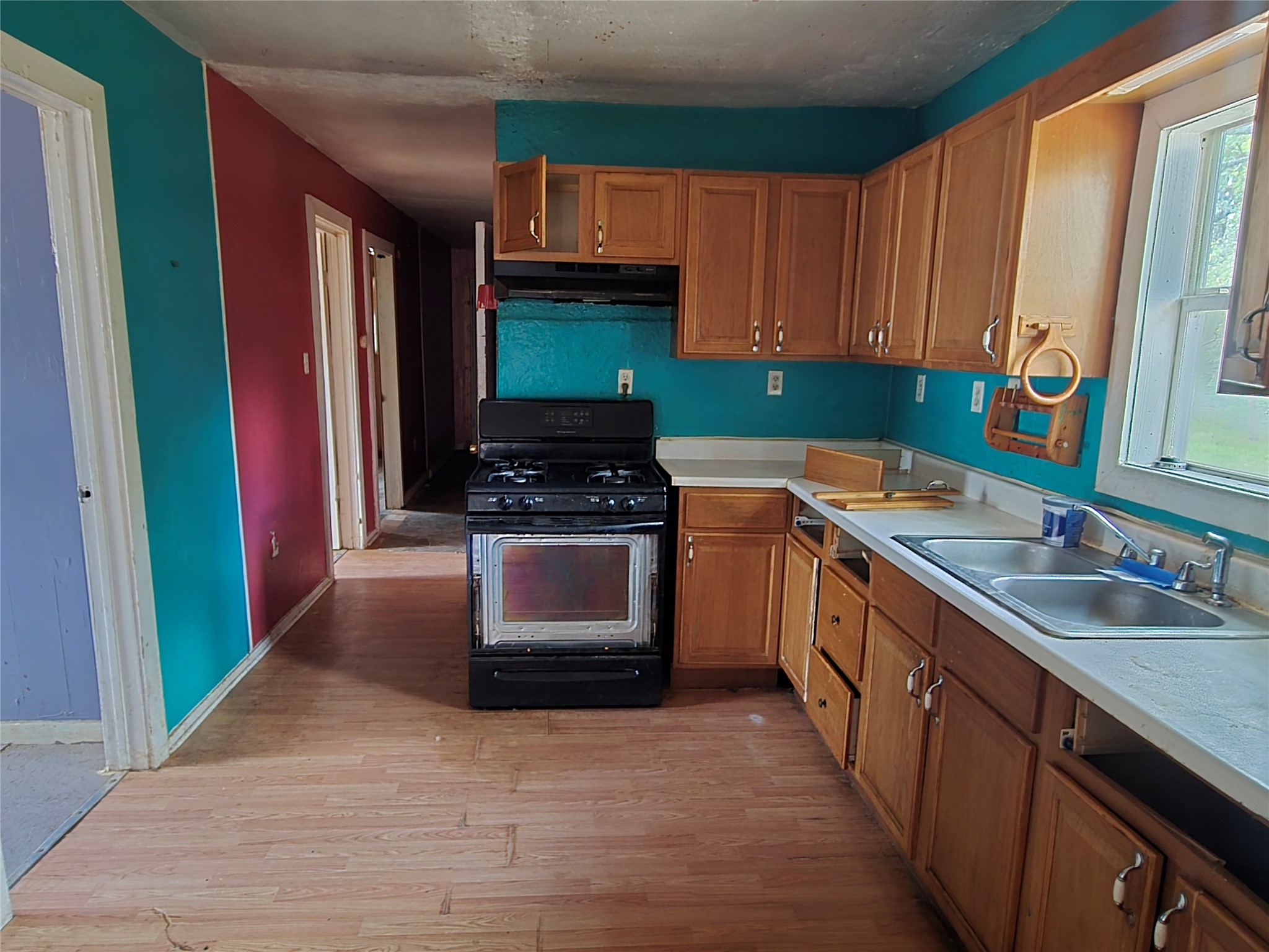 147 Sunset Heights Bastrop, TX 78602 - Photo 14 of 20 a kitchen with stainless steel appliances a sink stove and cabinets