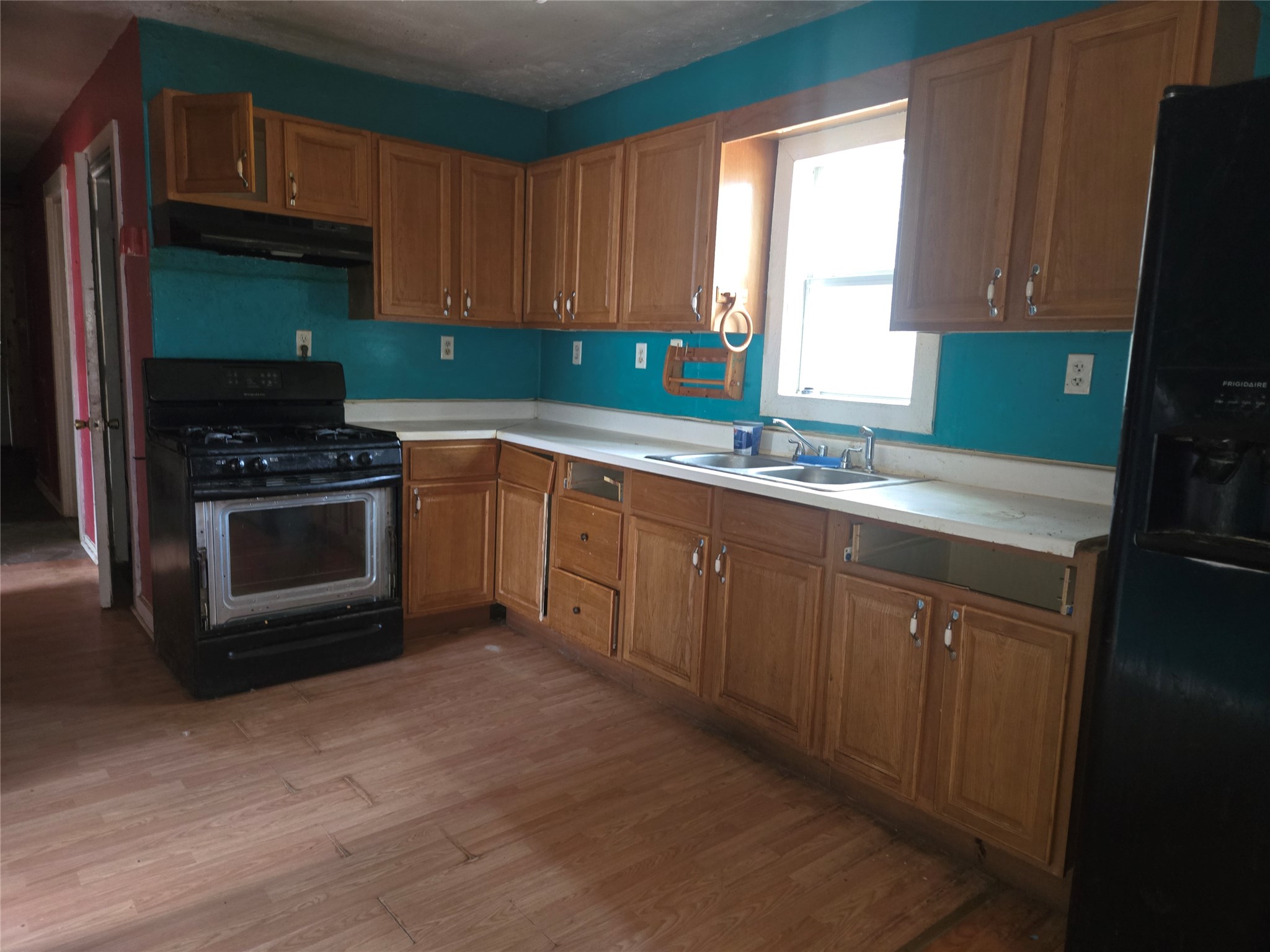 147 Sunset Heights Bastrop, TX 78602 - Photo 20 of 20 a kitchen with a sink cabinets and a window