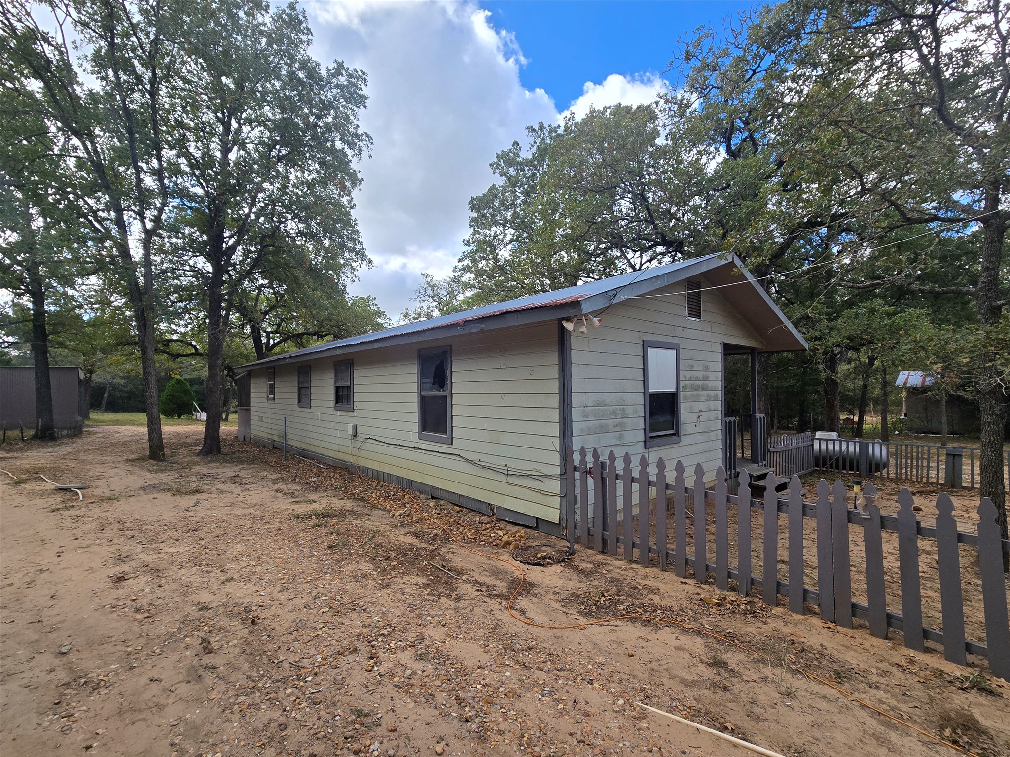 147 Sunset Heights Bastrop, TX 78602 - Photo 2 of 20 a house with trees in the background