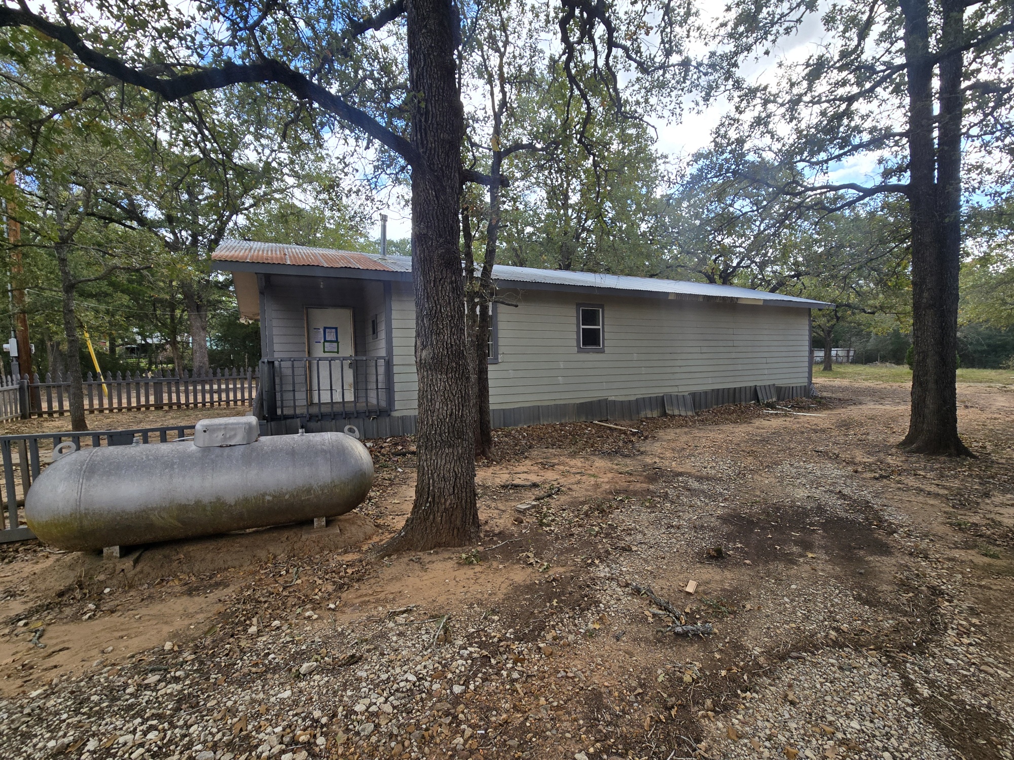 147 Sunset Heights Bastrop, TX 78602 - Photo 7 of 20 a view of a backyard with a large tree