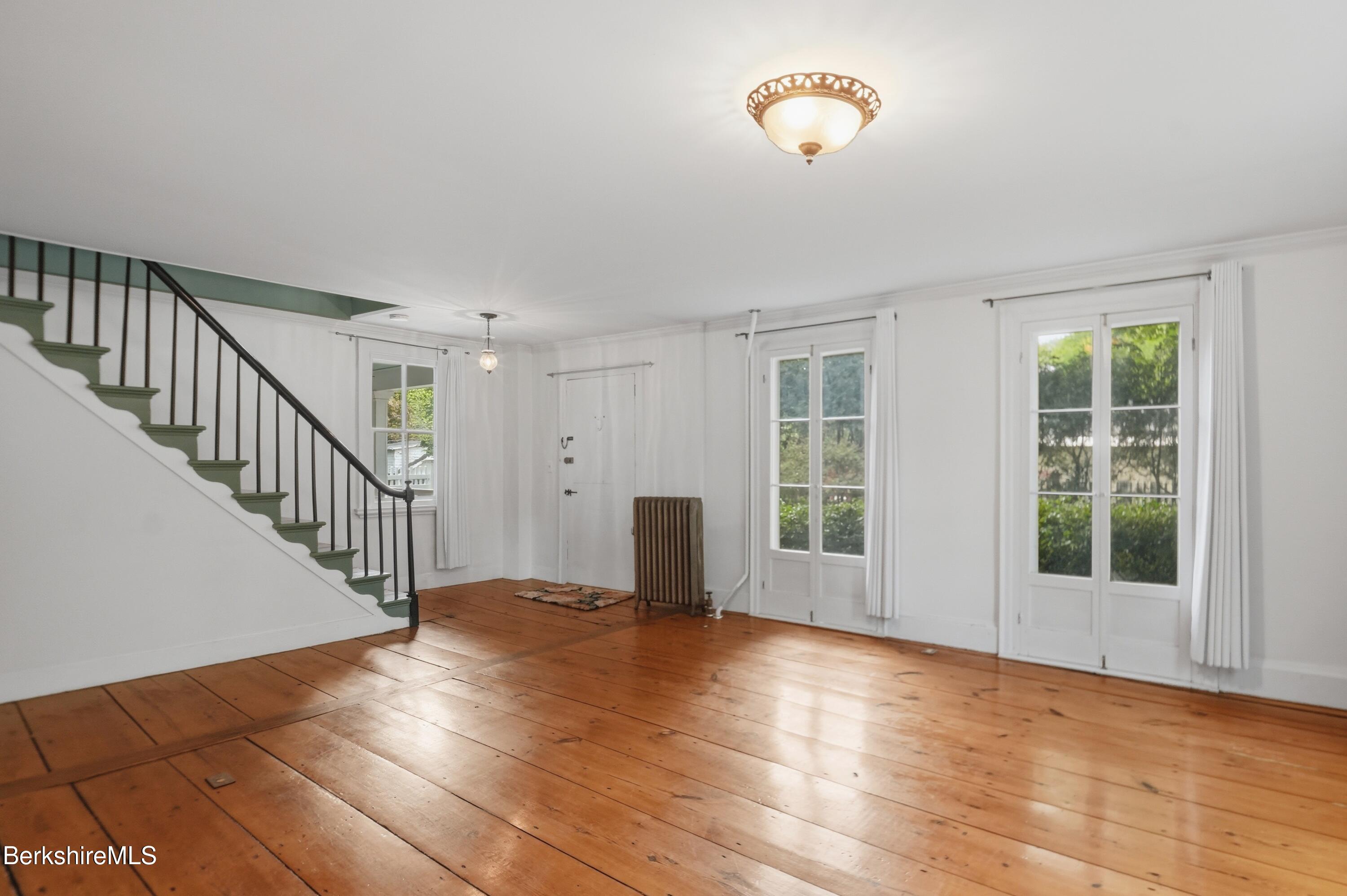 4 Stockbridge Road West Stockbridge, MA 01266 - Photo 15 of 94 a view of an empty room with wooden floor and a window