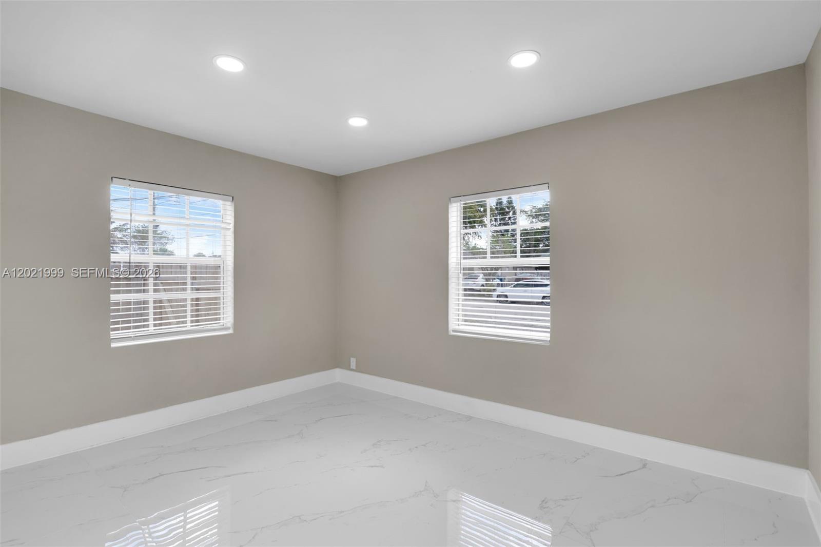 1660 West 26th Street Riviera Beach, FL 33404 - Photo 14 of 28 a view of an empty room with a window