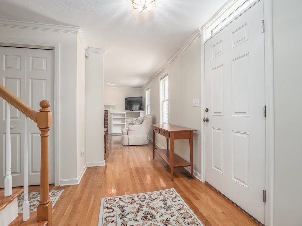 76 Williams Way Rochester, MA 02770 - Photo 16 of 42 a living room with stainless steel appliances furniture a rug and a kitchen view