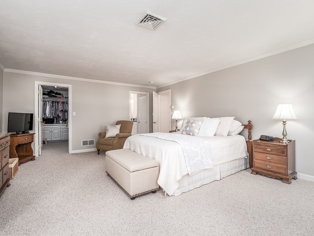 76 Williams Way Rochester, MA 02770 - Photo 20 of 42 a spacious bedroom with a bed and a couch