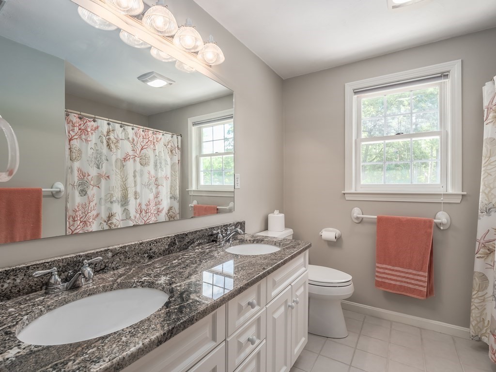 76 Williams Way Rochester, MA 02770 - Photo 22 of 42 a bathroom with a granite countertop double vanity sink large mirror bathtub and toilet