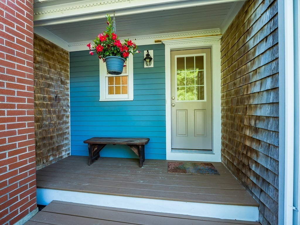 76 Williams Way Rochester, MA 02770 - Photo 31 of 42 a view of a house with a bench