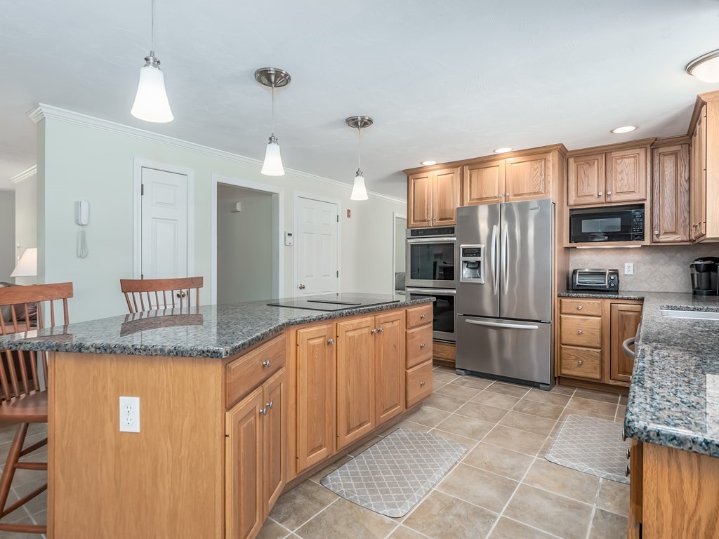 76 Williams Way Rochester, MA 02770 - Photo 7 of 42 a kitchen with stainless steel appliances granite countertop a refrigerator sink and cabinets